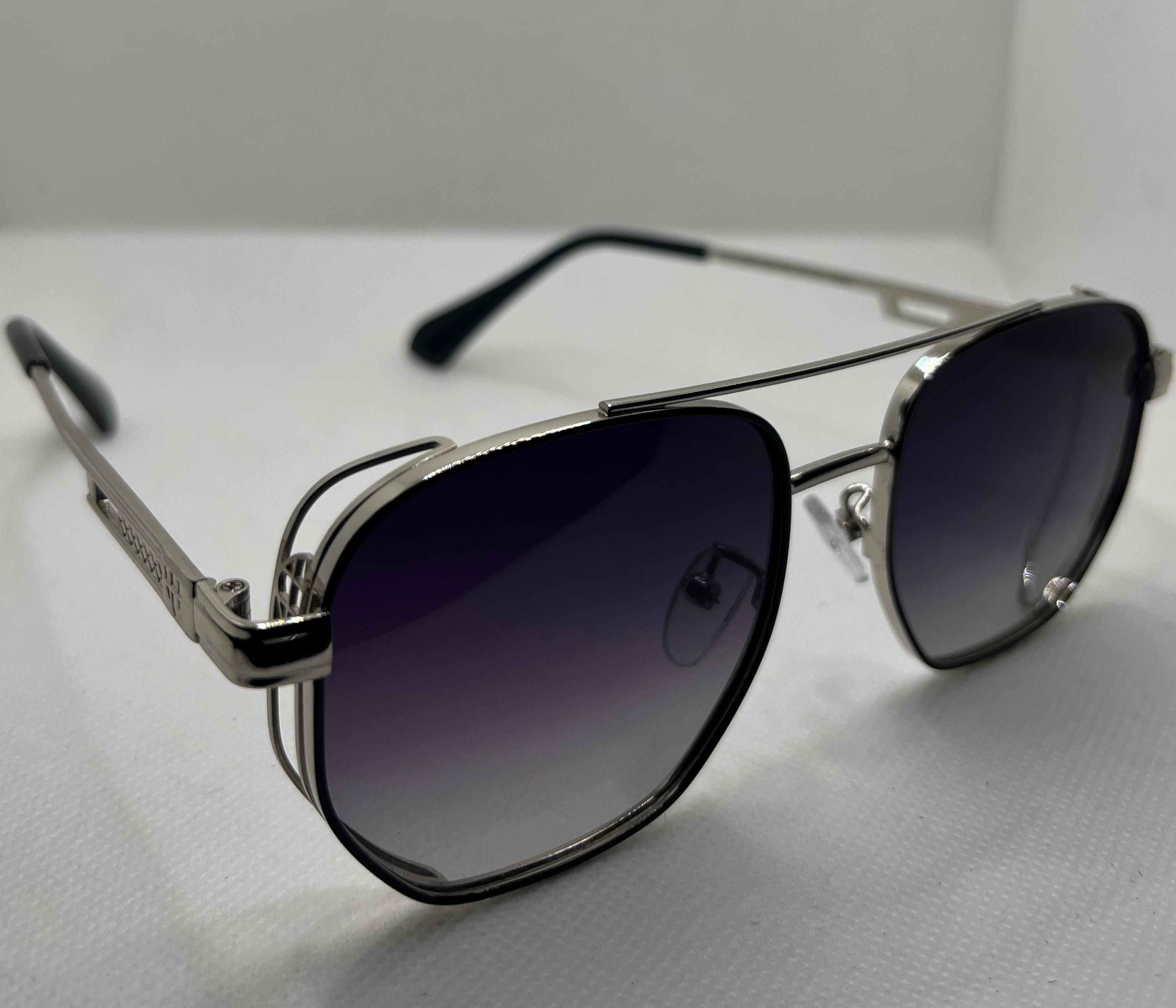 Meeran polo sunglasses with blue lenses and a black/silver frame, featuring UV protection